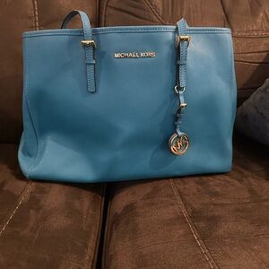Michael Kors Blue Totes with Elegant Gold Accents